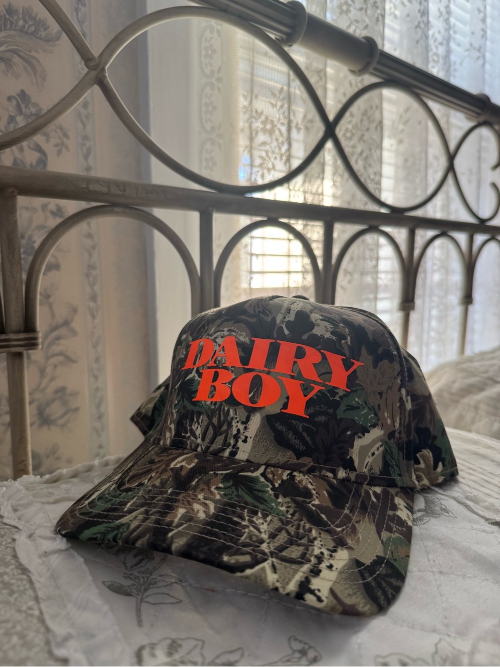Dairy Boy Orange Camo T-panel Trucker hat with classic Dairy Boy printed logo